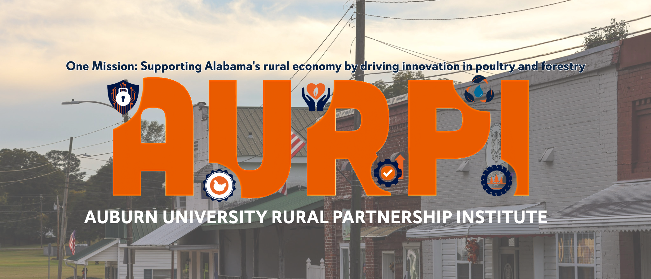 AURPI logo overlayed above a rural downtown area